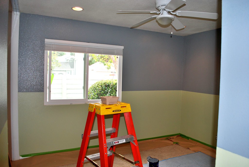 This photo shows a room that is ready to be painted. The walls have been prepared and the room is empty of furniture