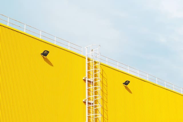 Vibrant Yellow Wall in a Commercial Painting Project - Showcasing the Expertise of Our Painting Team